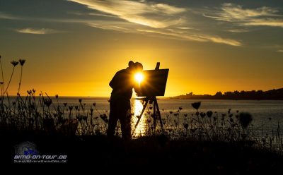 Maler im Sonnenuntergang